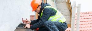 Man working on installing new roof