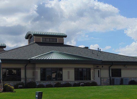 Metal , Shingle and Rubber Roofing on the Portage National Bank in Portage Wisconsin