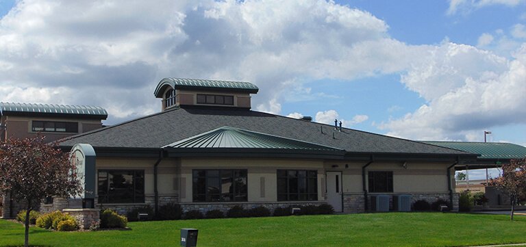 Metal , Shingle and Rubber Roofing on the Portage National Bank in Portage Wisconsin